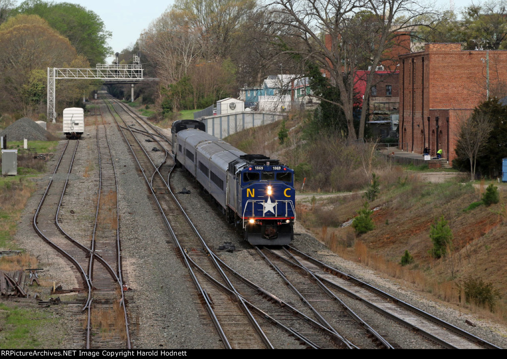 RNCX 1869 on the rear of train P075-25 as it shoves toward the station